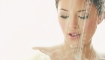 Juicy brunette is taking shower alone